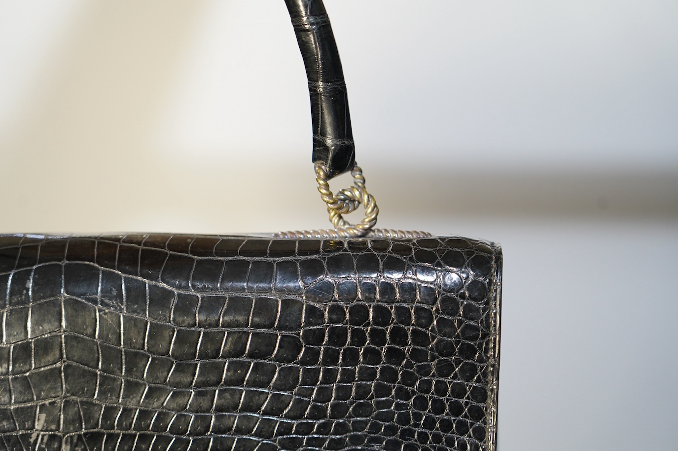 A Hermès vintage Cordeliere black crocodile handbag, height 16.5cm, top of handle 31cm, width 27.5cm, depth 5cm